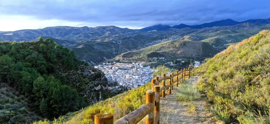 Hiking trail overlooking a white hillside town