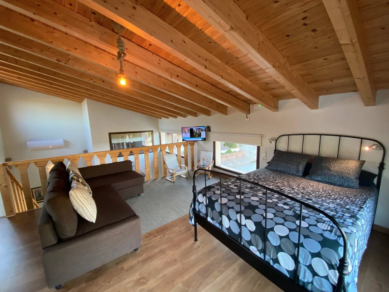 Attic bedroom with exposed wooden beams