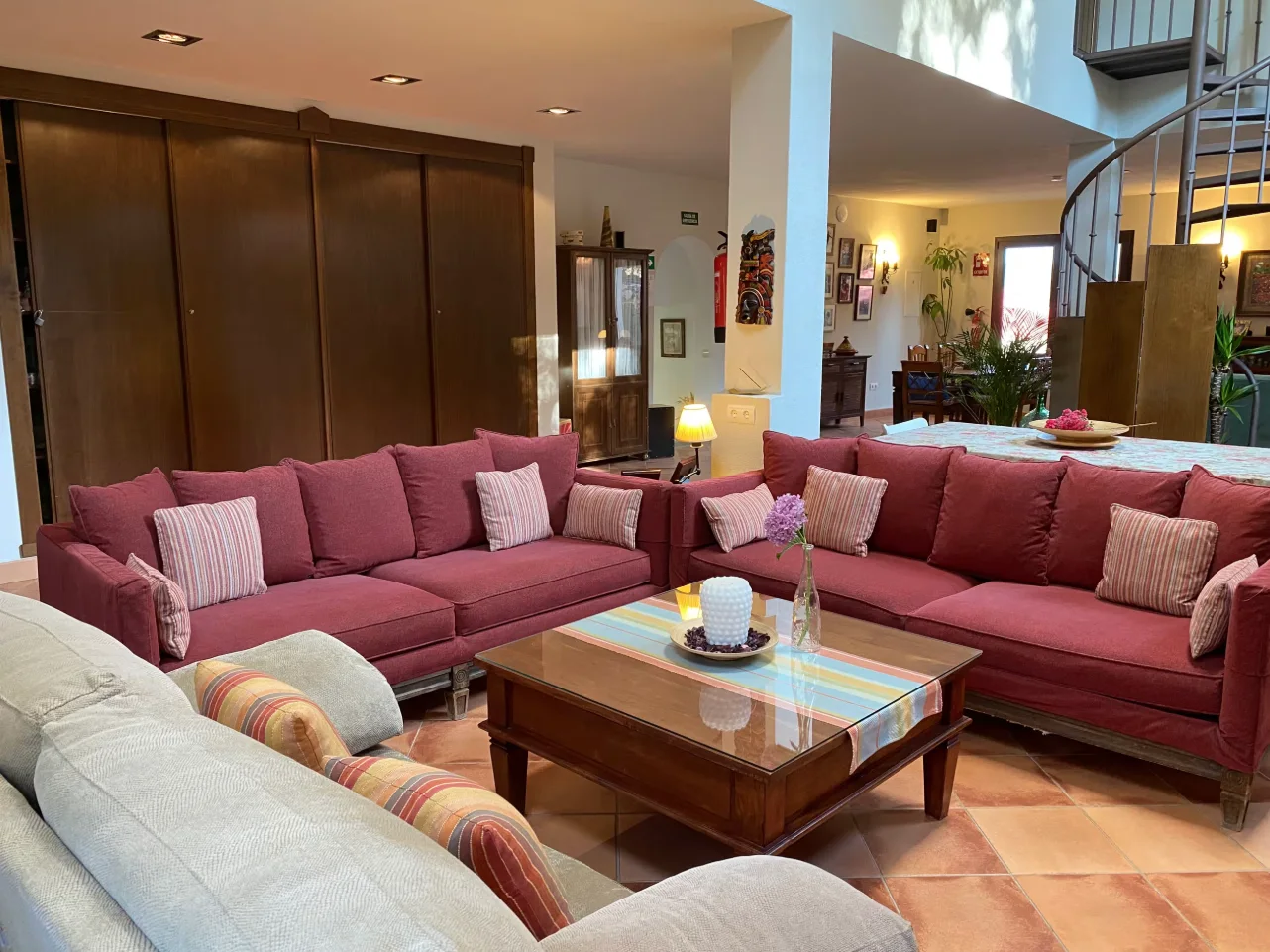 Spacious living room with sofas and a dining area beyond