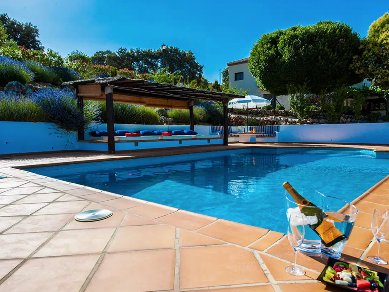 Pool with poolside cabana, evening drinks set out